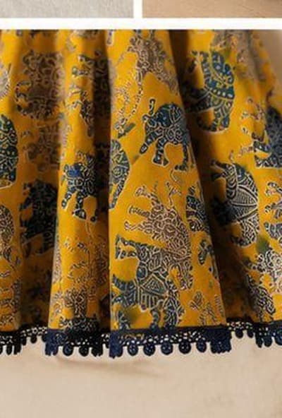 Mustard elephant print dress crochet trim detail